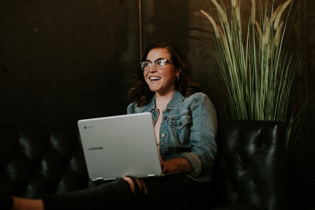 girl laughing at the computer