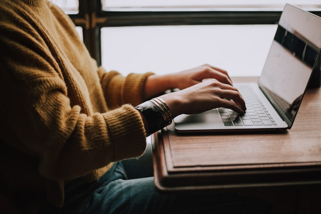 man playing at laptop