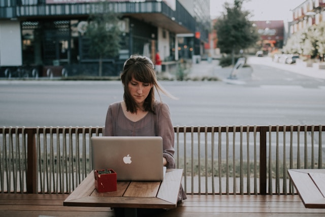 woman playing at laptop